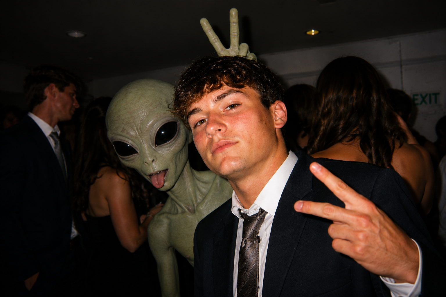 Guest posing with an alien party crasher